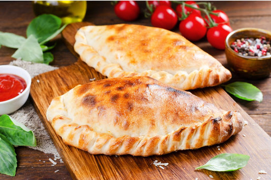 Delicious vegan calzone with vegan ricotta and mozzarella, served fresh with marinara sauce at your favorite eatery.